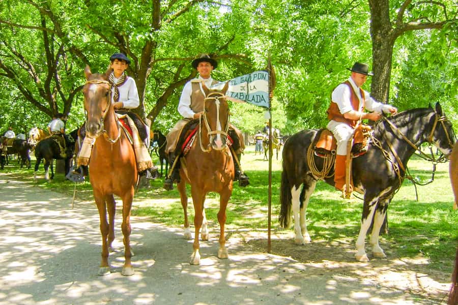 Two gauchos riding out on an estancia near Buenos Aires