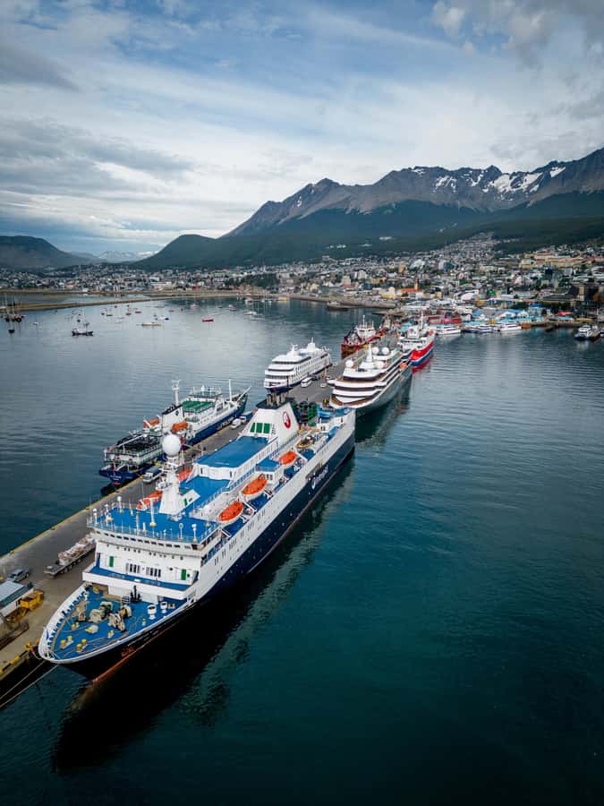 USHUAIA | City Tour + Martial Glacier Reserve - The Fin del Mundo signs and the old prison